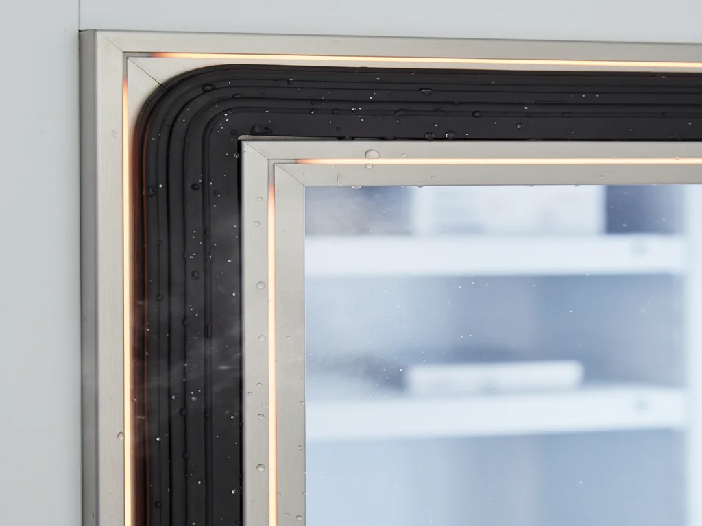 Heated door frame on a commercial walk-in freezer preventing gasket freeze and ice formation