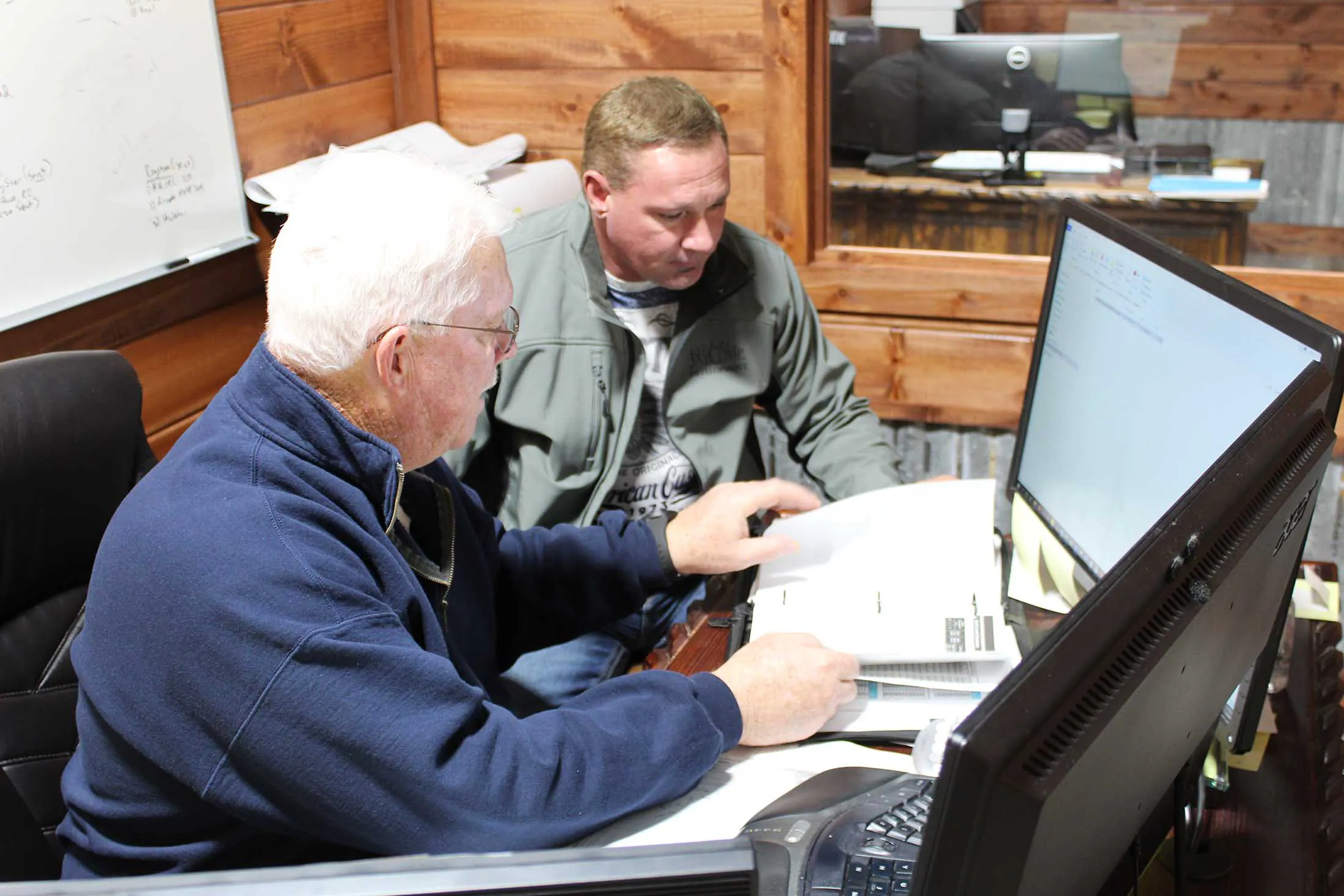 JayComp Development team members planning at a computer